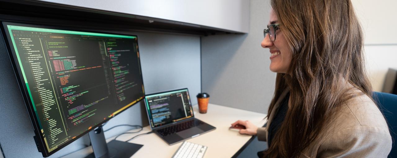 Woman developer at a workstation.